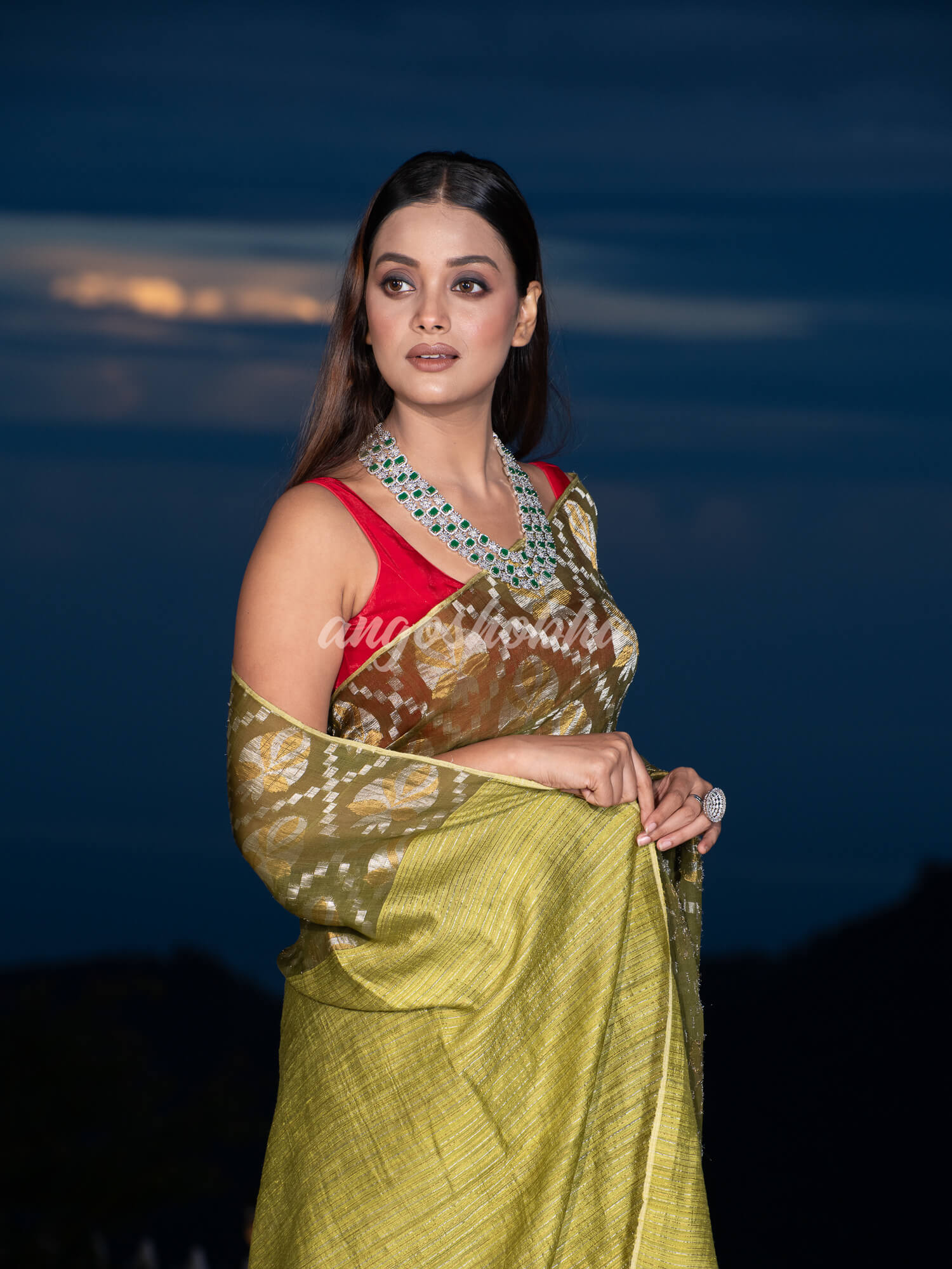 Olive Green Silk Matka Body with Leaves Intricate Design including Silver & Golden Stripes on Check Pallu Handwoven Saree