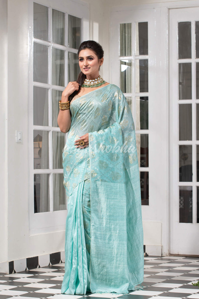 Teal Silk Matka Body with Leaves Intricate Design including Silver & Golden Stripes on Check Pallu Handwoven Saree