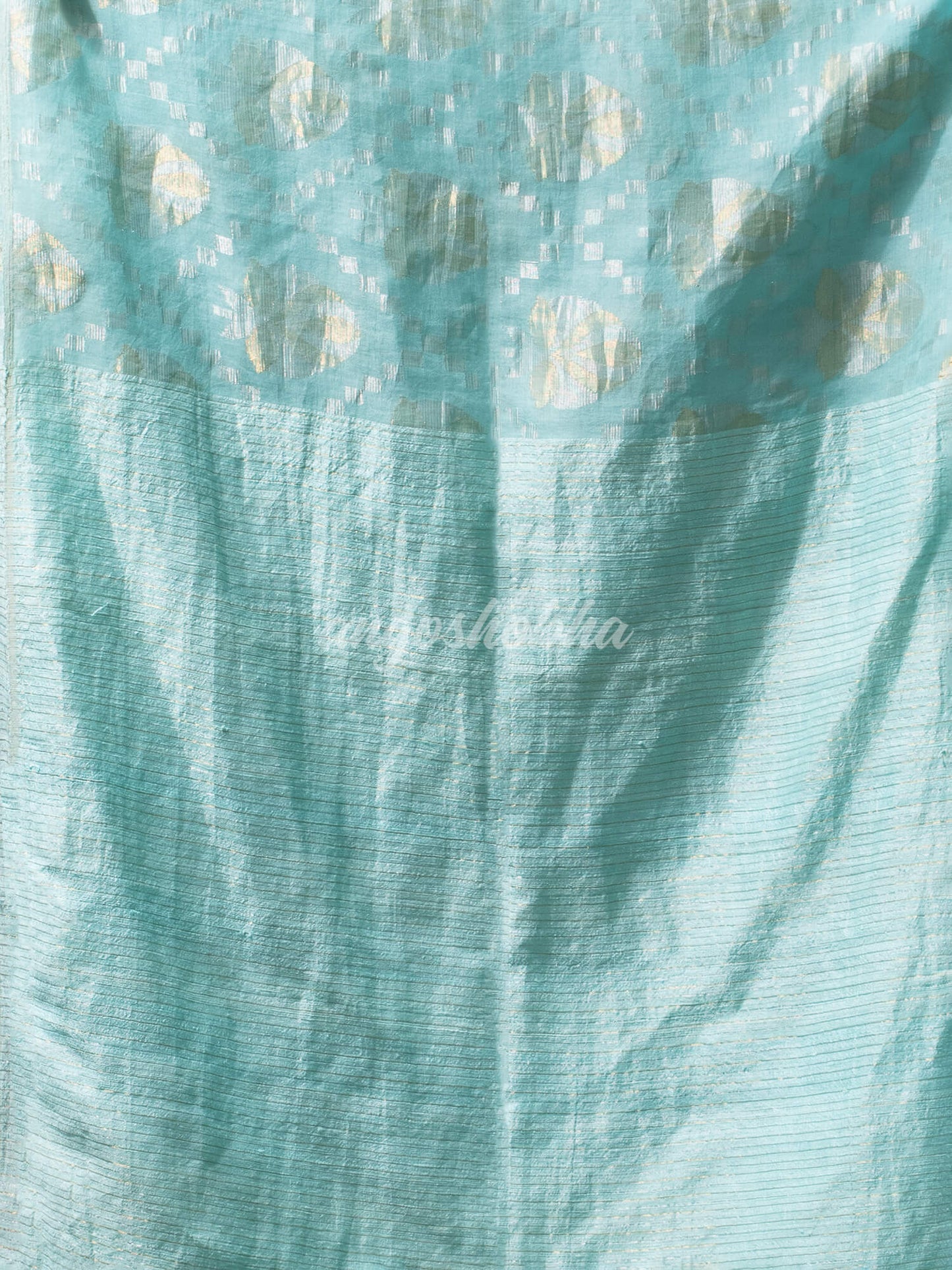 Teal Silk Matka Body with Leaves Intricate Design including Silver & Golden Stripes on Check Pallu Handwoven Saree