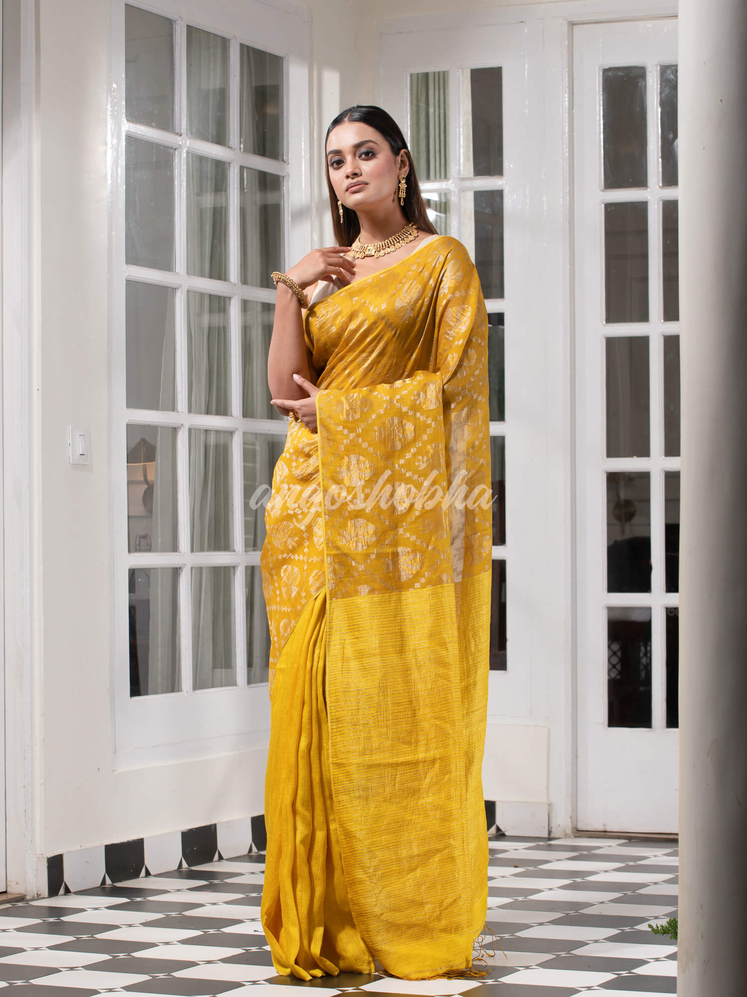 Yellow Silk Matka Body with Leaves Intricate Design including Silver & Golden Stripes on Check Pallu Handwoven Saree