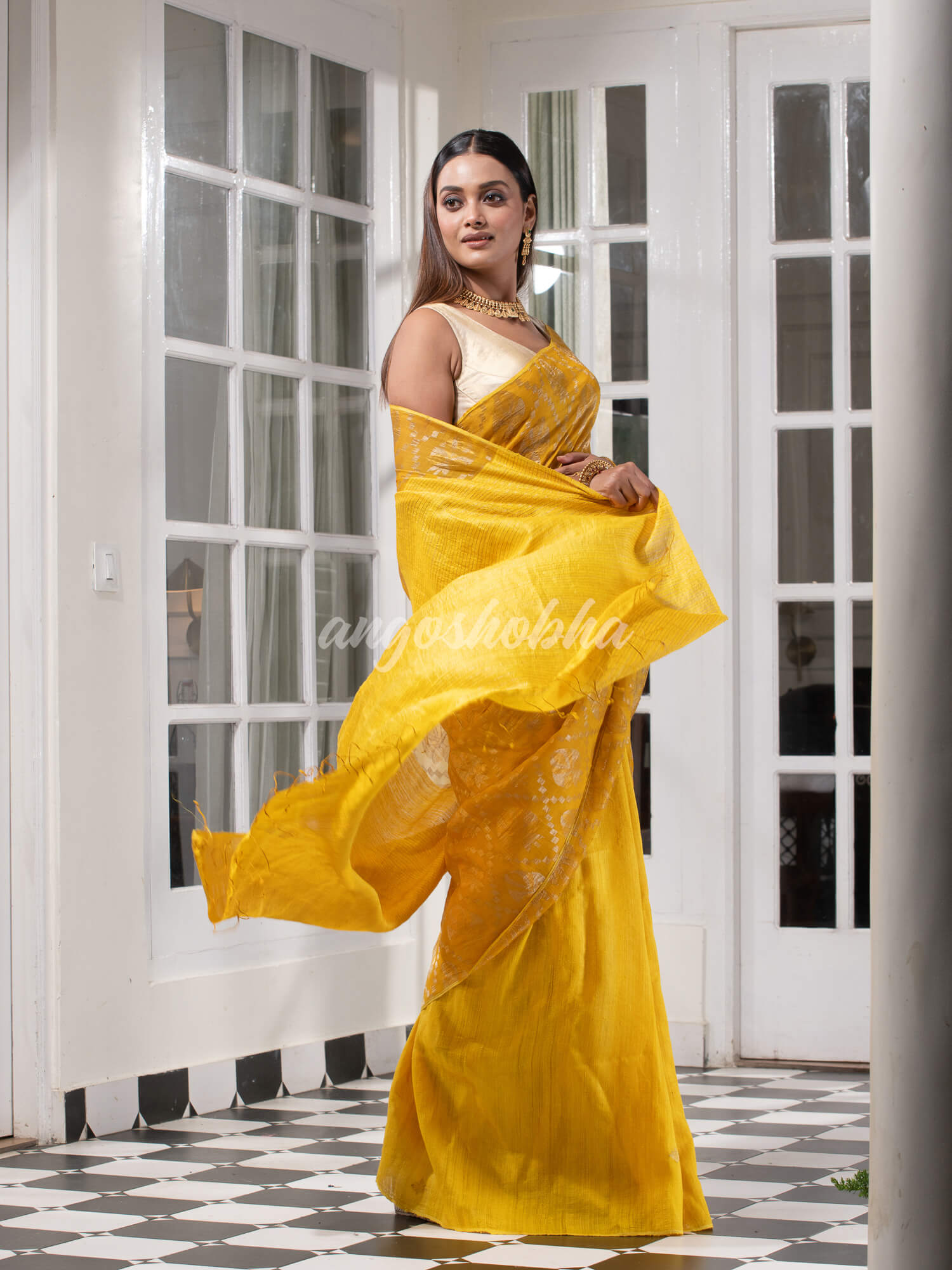Yellow Silk Matka Body with Leaves Intricate Design including Silver & Golden Stripes on Check Pallu Handwoven Saree