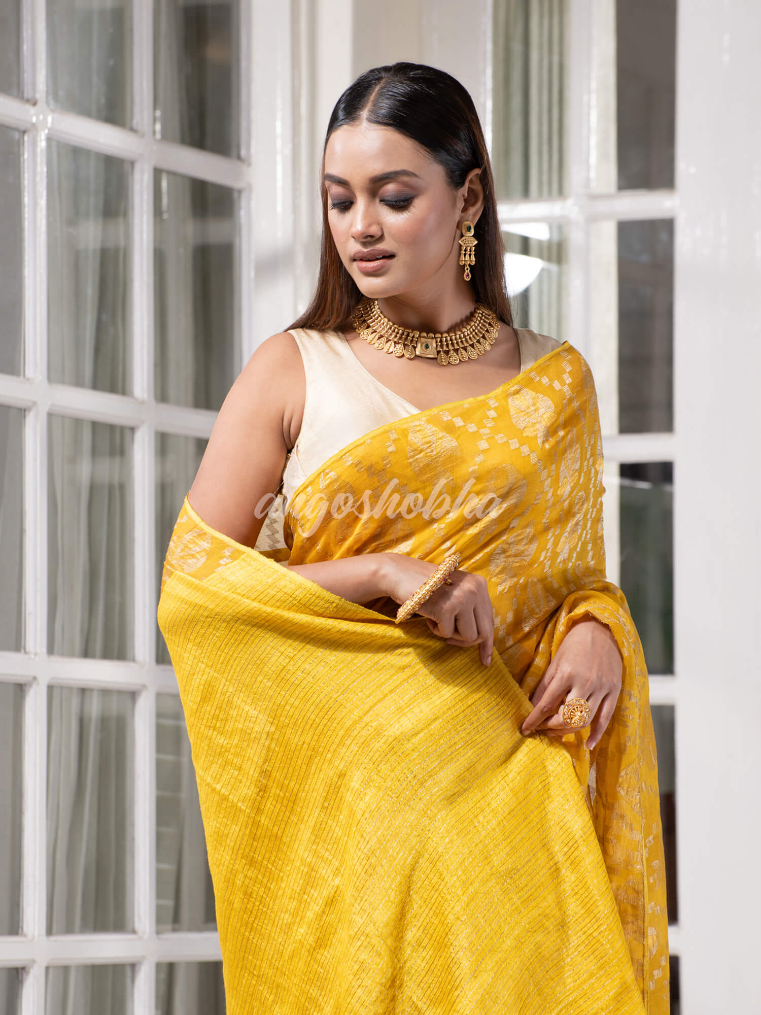 Yellow Silk Matka Body with Leaves Intricate Design including Silver & Golden Stripes on Check Pallu Handwoven Saree