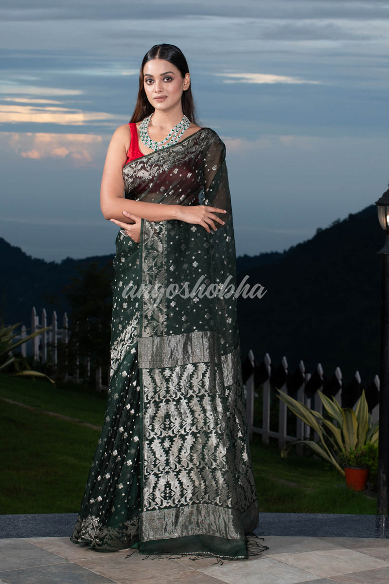 Bottle Green Silk Muslin Body and The Hem with Intricate Silver Motifs Design  Handwoven Saree