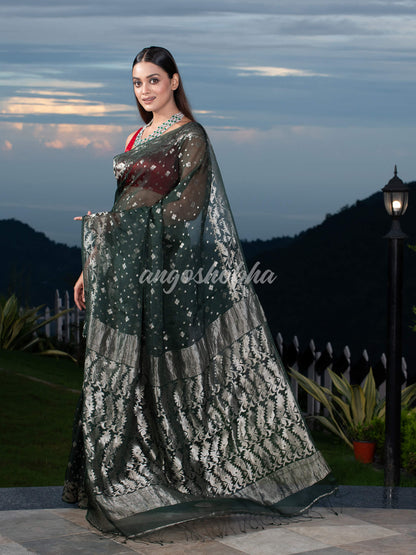 Bottle Green Silk Muslin Body and The Hem with Intricate Silver Motifs Design  Handwoven Saree