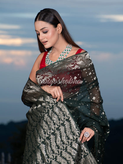 Bottle Green Silk Muslin Body and The Hem with Intricate Silver Motifs Design  Handwoven Saree