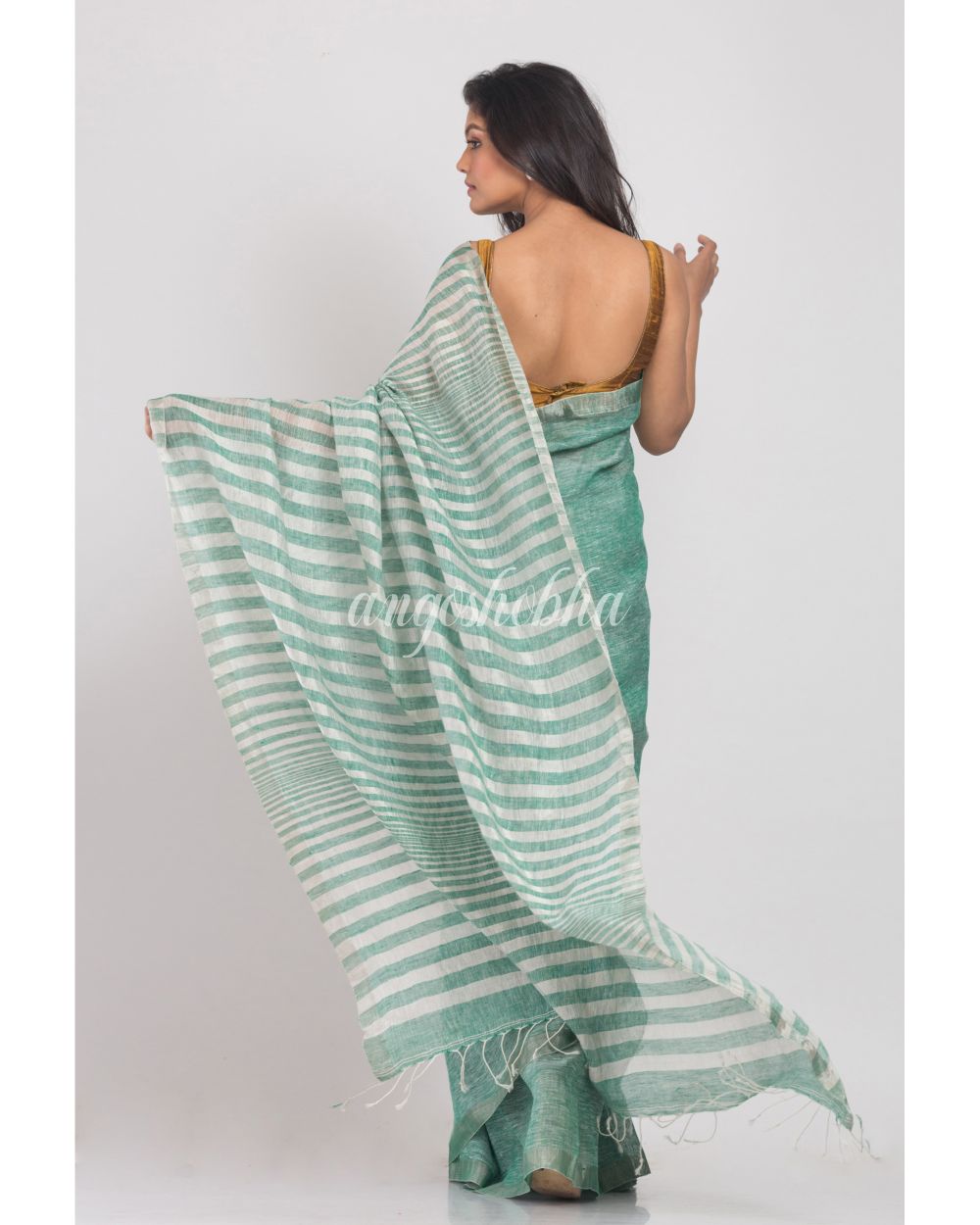 Green Handwoven Linen Saree angoshobha