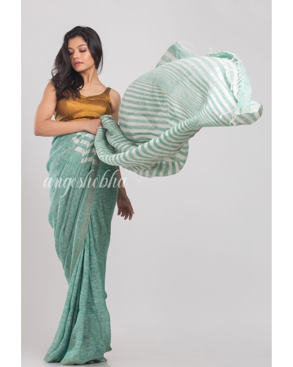 Green Handwoven Linen Saree angoshobha