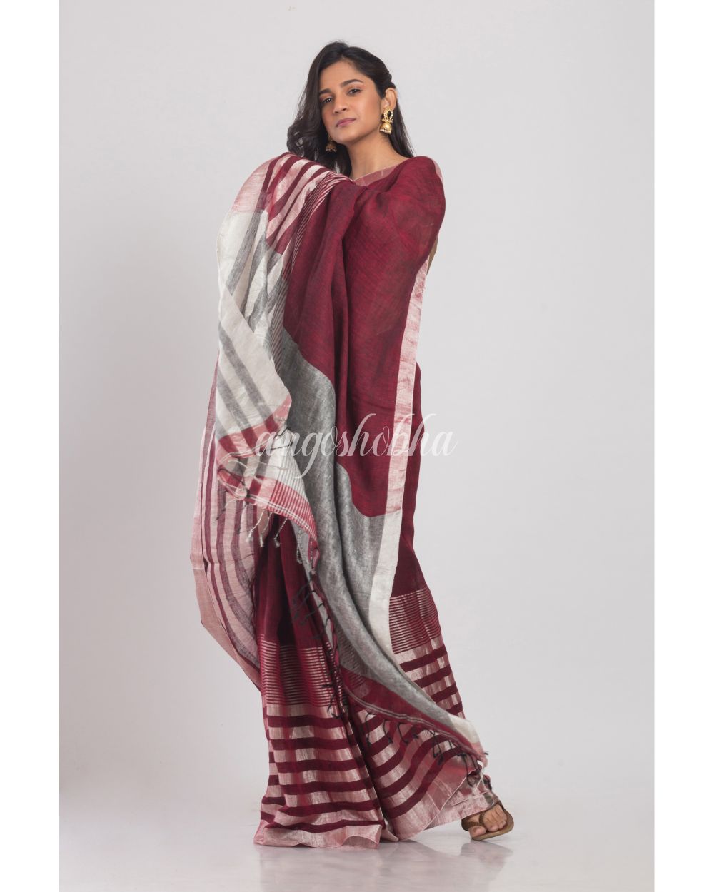 Maroon Linen Saree With Silver Zari Pallu And Border angoshobha