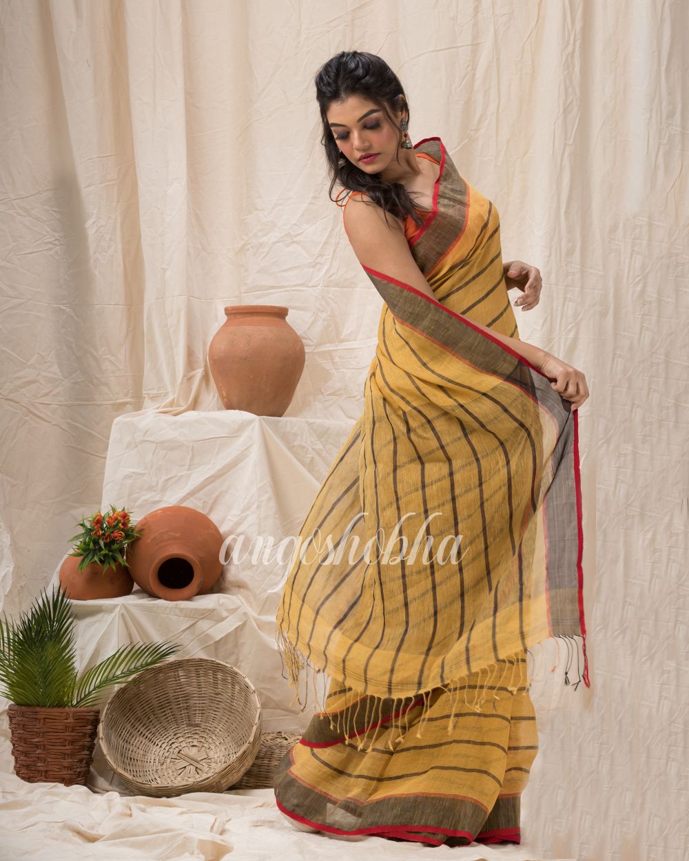 Sandy Brown Traditiona Linen Saree angoshobha